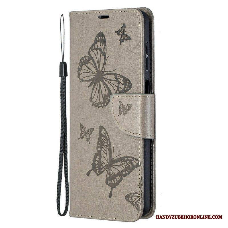 Flip Case Samsung Galaxy M12 / A12 Perhosia Lennossa Lanyardin Kanssa