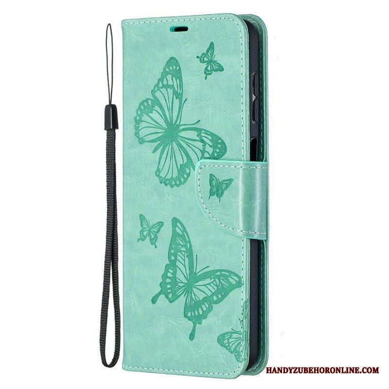 Flip Case Samsung Galaxy M12 / A12 Perhosia Lennossa Lanyardin Kanssa